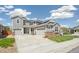 Inviting two-story home featuring stone accents, solar panels, and a three-car garage at 19471 W 59Th Ave, Golden, CO 80403