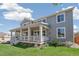 Charming two-story home with a covered porch and well-manicured lawn at 19471 W 59Th Ave, Golden, CO 80403