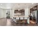 Spacious kitchen features a large island, stainless steel appliances, and dark wood cabinets at 19471 W 59Th Ave, Golden, CO 80403