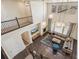 Lofted view of living room featuring three pendant lights, tall ceilings, fireplace, hardwood flooring and comfortable seating at 19471 W 59Th Ave, Golden, CO 80403
