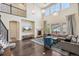 Comfortable living room features fireplace, high ceilings, hardwood floors, and an open concept design at 19471 W 59Th Ave, Golden, CO 80403