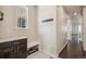 Convenient mud room featuring tile flooring, window for natural light, bench with shoe storage and coat hooks at 19471 W 59Th Ave, Golden, CO 80403
