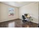 A compact and comfortable home office features hardwood floors and bright natural light at 19471 W 59Th Ave, Golden, CO 80403