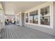 Inviting covered porch with ample seating and stylish decor, perfect for relaxing and enjoying the outdoors at 19471 W 59Th Ave, Golden, CO 80403