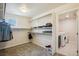 Spacious walk-in closet with ample shelving and storage, plus convenient laundry area with a washer and dryer at 19471 W 59Th Ave, Golden, CO 80403