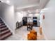 Spacious finished basement featuring a kitchenette, game area with foosball table, and modern flooring at 10669 Worchester Dr, Commerce City, CO 80022
