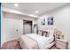Inviting bedroom featuring a plush bed, closet, and elegant decor for relaxation at 10669 Worchester Dr, Commerce City, CO 80022