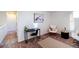 Well-lit bedroom space with a desk and dual chairs on top of a carpeted floor at 10669 Worchester Dr, Commerce City, CO 80022