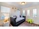 Bedroom area with a daybed, decorative pillows, and well-lit space at 10669 Worchester Dr, Commerce City, CO 80022