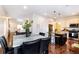 Open-concept layout connects dining room to living room and modern kitchen at 10669 Worchester Dr, Commerce City, CO 80022