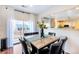 Bright dining area features a marble table and modern decor, adjacent to the kitchen at 10669 Worchester Dr, Commerce City, CO 80022