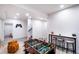 Basement game room area with foosball table, bar seating, and open layout at 10669 Worchester Dr, Commerce City, CO 80022
