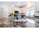 Bright, open kitchen showcases modern appliances and a marble-topped island at 10669 Worchester Dr, Commerce City, CO 80022