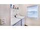 Bright laundry room with modern white washer and dryer at 10669 Worchester Dr, Commerce City, CO 80022