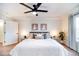 Bright main bedroom featuring a king bed, neutral tones, and ample natural light at 10669 Worchester Dr, Commerce City, CO 80022