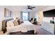 A cozy main bedroom with a king bed, neutral décor, and lots of light at 10669 Worchester Dr, Commerce City, CO 80022