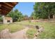 Spacious backyard featuring a shed, partial fence, and garden bed at 3246 S Nucla St, Aurora, CO 80013