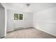 Finished basement room with paneled walls, carpet, and bright natural light at 3246 S Nucla St, Aurora, CO 80013