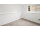 Clean basement room with carpet, paneled walls, and good natural light at 3246 S Nucla St, Aurora, CO 80013