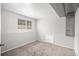 Finished basement space with neutral carpet and a window letting in natural light at 3246 S Nucla St, Aurora, CO 80013