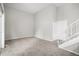 Carpeted room with high ceilings, closet doors, and staircase access, great as a loft or bedroom at 3246 S Nucla St, Aurora, CO 80013