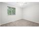 Cozy bedroom with neutral carpet and natural light coming in from the large window at 3246 S Nucla St, Aurora, CO 80013