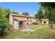 A two-story home featuring a spacious backyard with partial fence and outdoor building at 3246 S Nucla St, Aurora, CO 80013
