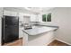 Efficient kitchen design, featuring modern appliances, white cabinetry, and a practical layout for cooking at 3246 S Nucla St, Aurora, CO 80013