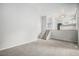 Loft area with carpet, stairs, an open floor plan, and access to the kitchen and dining area at 3246 S Nucla St, Aurora, CO 80013