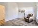 Bright bedroom featuring wood floors, natural light, and tasteful decor, creating a cozy and inviting space at 10311 Adams Pl, Thornton, CO 80229