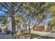 Lovely two-story home with a brick and siding exterior, surrounded by mature trees and landscaping at 10311 Adams Pl, Thornton, CO 80229