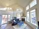 Bright living room with fireplace and natural light at 10311 Adams Pl, Thornton, CO 80229