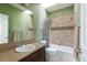 Inviting bathroom with a shower and bathtub combination, tile accents, and a neutral vanity at 2800 Aurora Ave # 121, Boulder, CO 80303