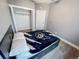 Cozy bedroom featuring a closet, drawers under bed, and a modern color scheme at 2800 Aurora Ave # 121, Boulder, CO 80303