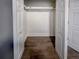 An empty closet featuring brown wood-look floors at 2800 Aurora Ave # 121, Boulder, CO 80303