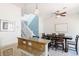Dining area features a modern table with seating for six, ceiling fan, and staircase at 2800 Aurora Ave # 121, Boulder, CO 80303