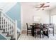 Bright dining room with a ceiling fan and staircase leading to the next level at 2800 Aurora Ave # 121, Boulder, CO 80303