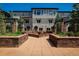 A well-maintained building exterior with a central courtyard and stone planters, showing a tranquil setting at 2800 Aurora Ave # 121, Boulder, CO 80303