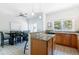 Open floor plan with kitchen and dining room and tile floors at 2800 Aurora Ave # 121, Boulder, CO 80303