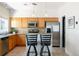Kitchen area with stainless steel appliances and updated cabinets at 2800 Aurora Ave # 121, Boulder, CO 80303