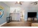 Open-concept living area featuring hardwood flooring and staircase with white railing at 2800 Aurora Ave # 121, Boulder, CO 80303