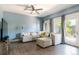 Cozy living room with hardwood flooring, comfortable seating, and doors leading to the outside at 2800 Aurora Ave # 121, Boulder, CO 80303