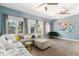 Bright living room with hardwood floors, comfortable seating, and large windows providing plenty of natural light at 2800 Aurora Ave # 121, Boulder, CO 80303