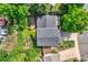 Aerial view of house with lush greenery, large deck, and a well-maintained roof at 284 S Lincoln Ave, Louisville, CO 80027