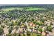 An aerial view of the neighborhood with mature trees and greenery and a neighborhood street at 284 S Lincoln Ave, Louisville, CO 80027