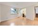 Spacious basement area with light wood floors, natural light, and bathroom entrance at 284 S Lincoln Ave, Louisville, CO 80027