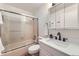Bathroom featuring a bathtub-shower combo with a glass sliding door and modern vanity at 284 S Lincoln Ave, Louisville, CO 80027