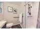 Bright bathroom featuring a shower with white subway tile, safety bars, and modern fixtures at 284 S Lincoln Ave, Louisville, CO 80027