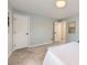 Bedroom with two doors, neutral carpet, and soft color scheme for a relaxing retreat at 284 S Lincoln Ave, Louisville, CO 80027
