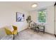 Well-lit bedroom with natural light, neutral carpet, stylish desk and yellow chair at 284 S Lincoln Ave, Louisville, CO 80027